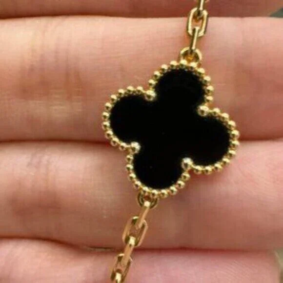 Van Cleef & Arpels 18K gold onyx 5-flower bracelet